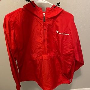 1/4 zipper windbreaker with the champion logo on it.